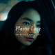A woman sits in the back of a taxi while "Plastic Love Mariya Takeuchi" flashes on the screen.